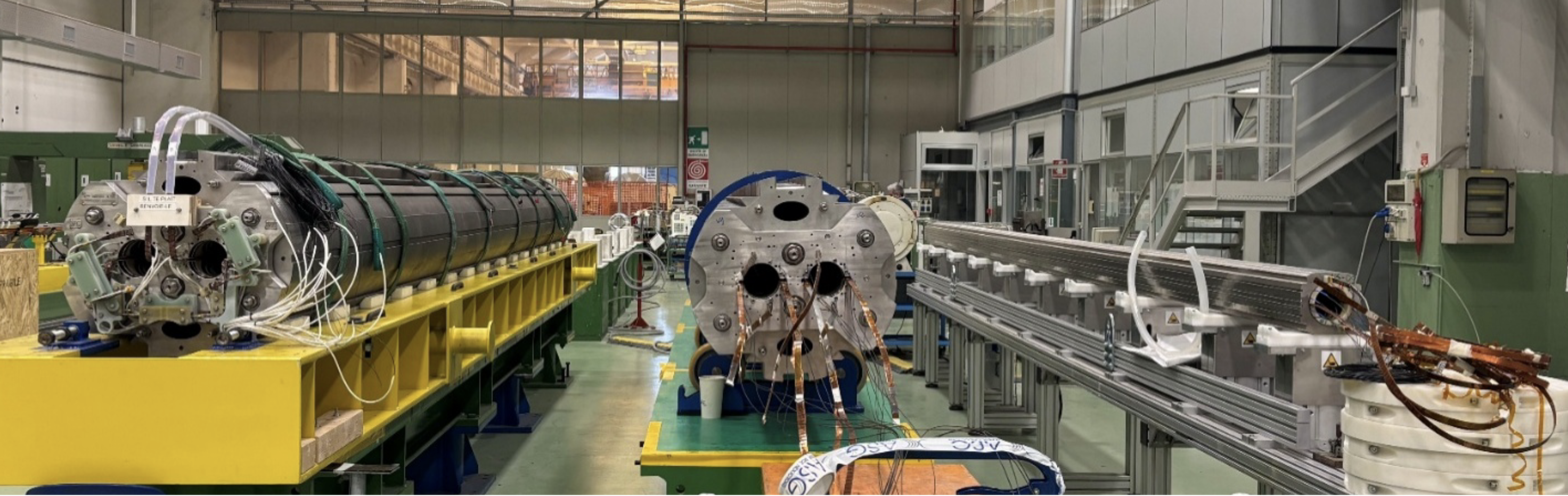 three cylindrical pieces of equipment - magnets in different stages