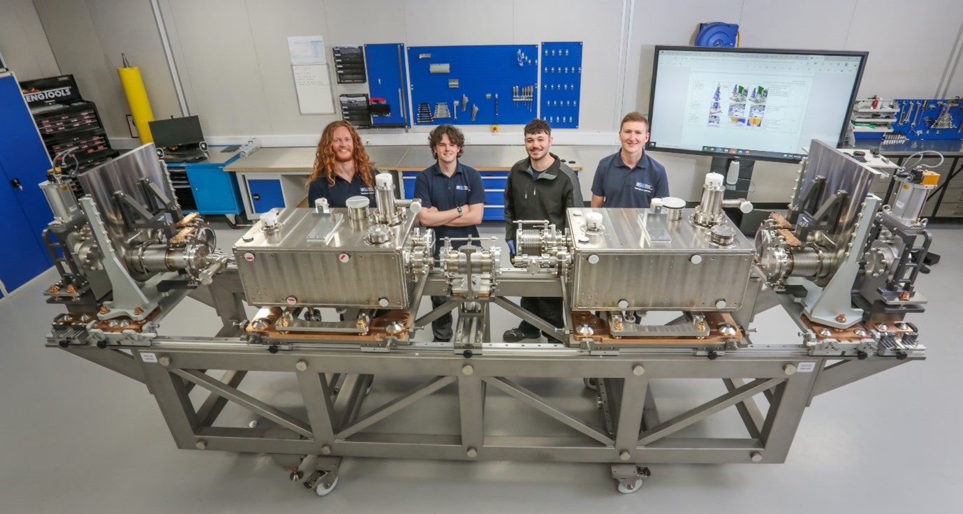 Fig. 2: STFC-DL technicians adjacent to the Cavity String prior to Cleanroom assembly