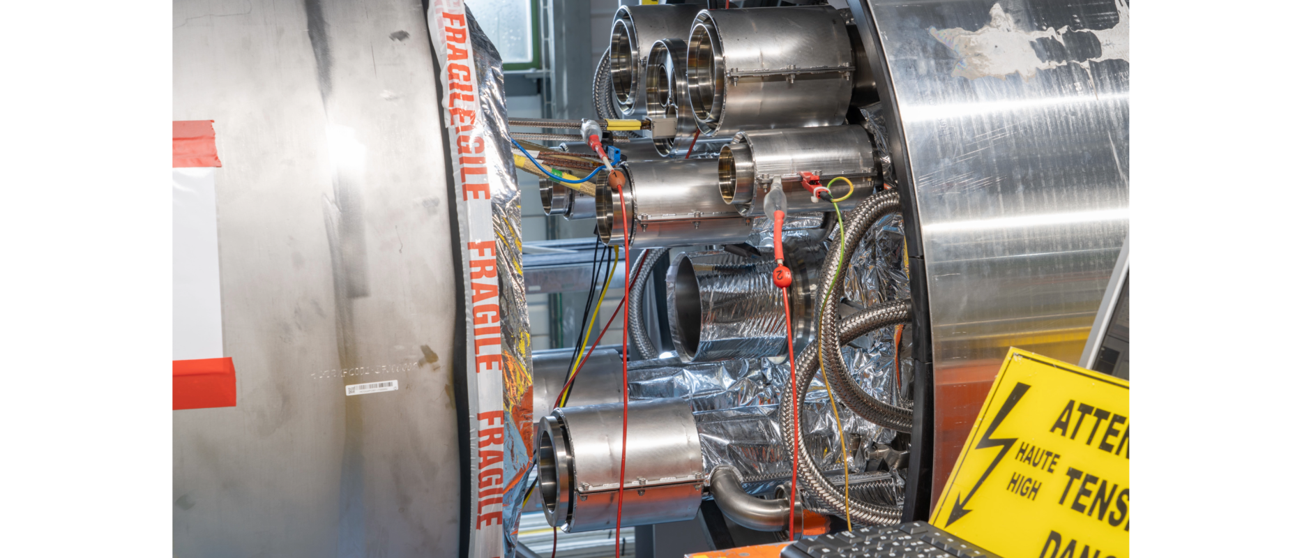 connection between two big cylinders with sign that testing is happening